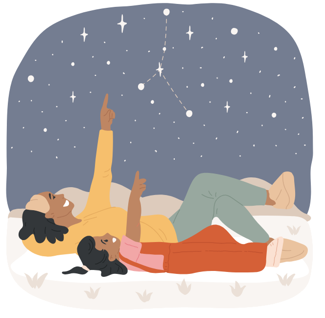 People lying on the ground, watching the stars